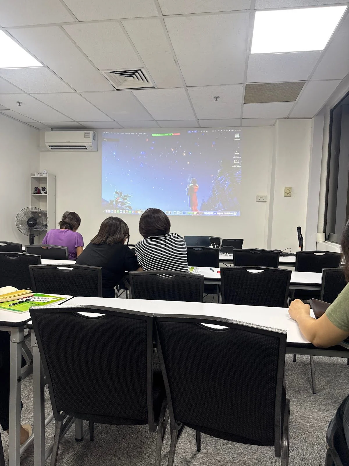 A Korean class watching a lesson on the projector