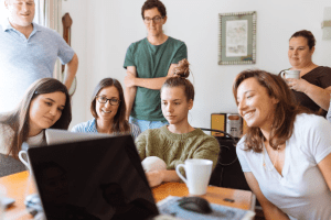 People looking at a laptop