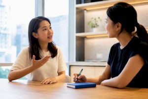 Adult learner practising Korean with instructor