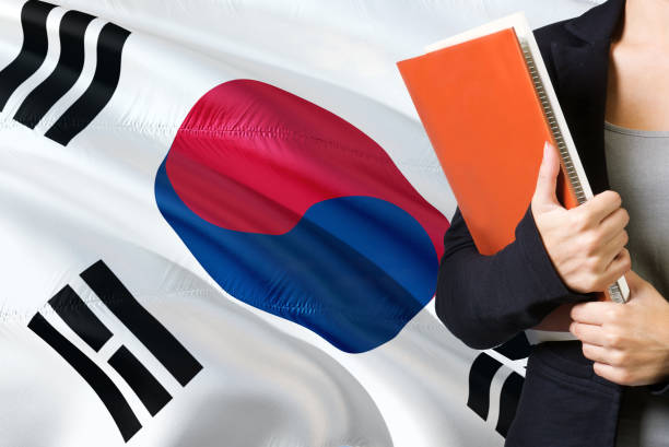 https://media.istockphoto.com/id/1131591575/photo/learning-south-korean-language-concept-young-woman-standing-with-the-south-korea-flag-in-the.jpg?s=612x612&w=0&k=20&c=xfathHwF1fWd3yo6VionXzfHqfLjGT1pBKSJ1DgtGJU=