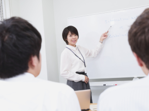 Teacher presenting a lesson on internationalization versus globalization to an adult student.