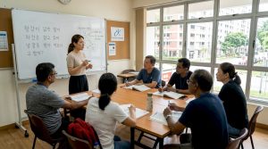 Korean teacher leading class in Singapore
