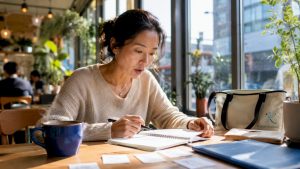 Woman practicing language skills at home