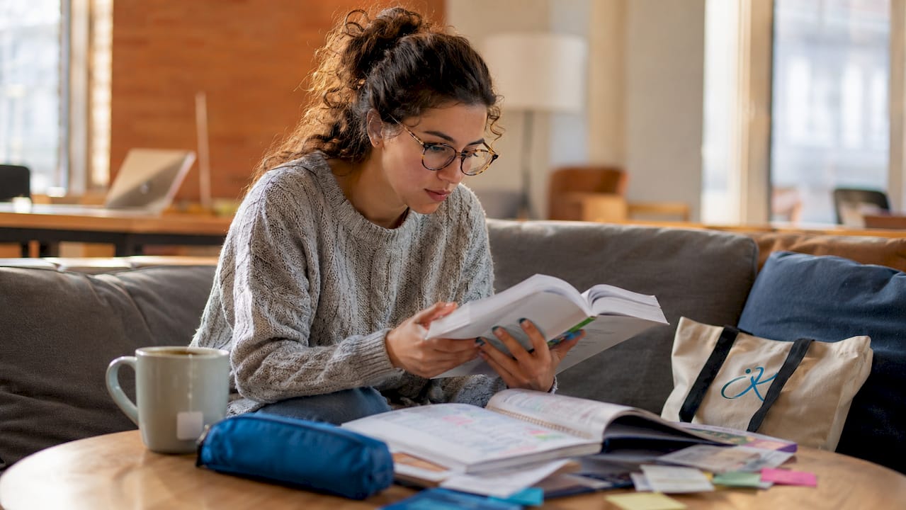 Woman studying language curriculum materials