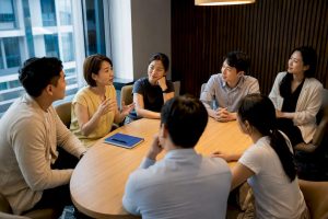 Adults practising Korean in small group class
