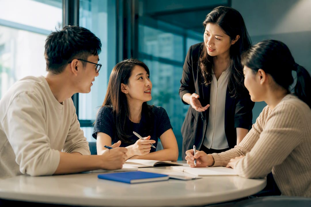 Small group practising Korean conversation