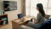 Woman learning Korean through TV immersion at home