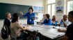 Korean teacher leading class in Singapore community room