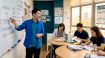 Korean teacher explaining grammar to adult students