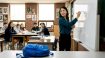 Korean teacher writing in high school classroom