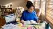 Learner studying Korean at home desk
