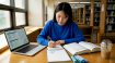 Student studying academic Korean in library