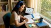 Woman practicing Korean listening and speaking at home