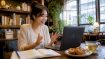 Woman practicing language learning online at cafe