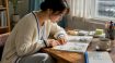 Learner studying Korean textbook at desk