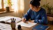 Woman practicing Korean Hangeul calligraphy