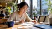 Woman practicing language skills at home