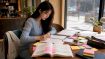 Student at desk studying for TOPIK exam