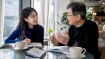Woman practicing Korean conversation in traditional home