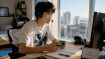 Gamer learning Korean with game on screen