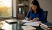 Instructor reviewing structured language curriculum documents