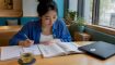 Beginner learning Hangul at home desk