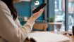 Hand holding smartphone for Korean pronunciation practice