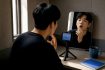 Adult practising Korean vowel pronunciation