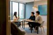 Adults practising Korean conversation in class