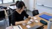 Learner sorting TOPIK vocabulary cards by level